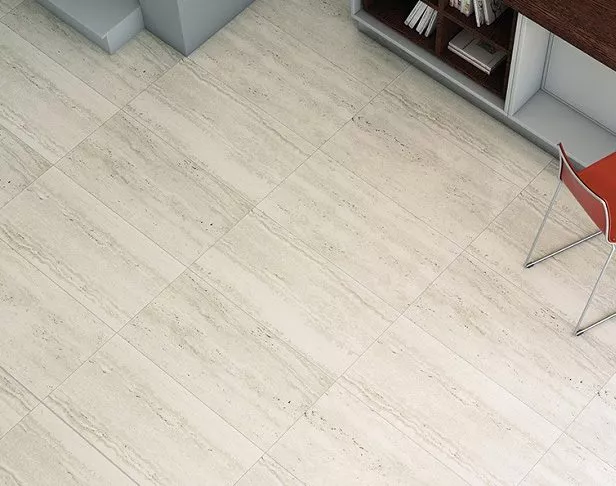 white travertine-look floor tile in a modern kitchen