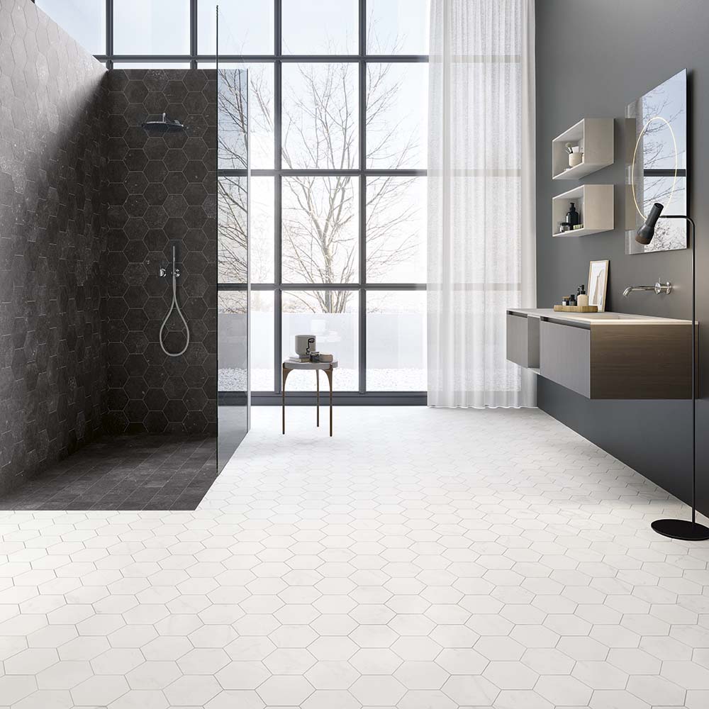 Belgica Due belgian bluestone look porcelain tile shower and Belgica Due white Carrara marble-look tile hexagons on floor