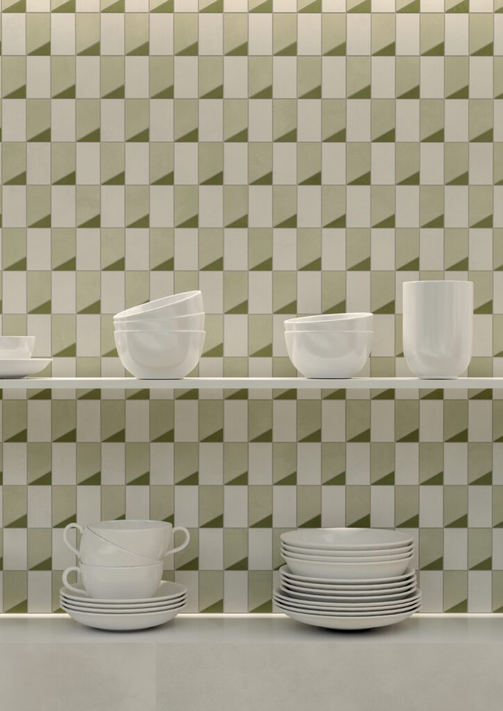 Sage Green geometric rectangle shaped mosaics tiled on a kitchen wall with shelves and white coffee cups and saucers.