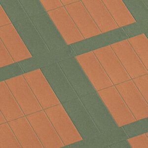 Terracotta colored and green rectangular tiled floor in a grid pattern