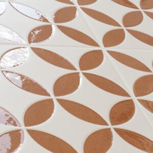 Terracotta colored and white square tiles with a petal pattern