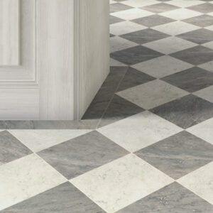 White and gray marble tiles in a checkerboad pattern in a foyer
