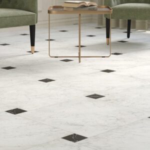 Square White marble tile and smaller square black marble tiles in a dot pattern with green sitting chairs and brass side table
