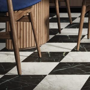 Black and white marble tiles in a checkerboard pattern tiling a modern mid-century styled kitchen
