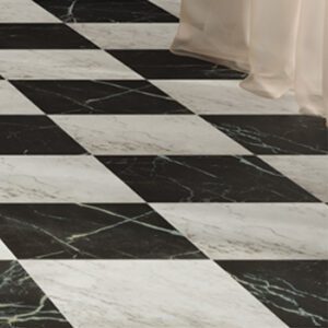 White and black marble tiles in a checkerboard pattern tiling a floor