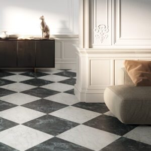 Square white marble tile and square dark green tile in a checkerboard pattern with dark brown credenza and beige sitting chair
