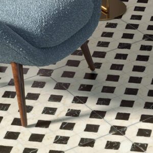 Black and white marble tiles in a lattice pattern tiled floor with a blue MCM chair