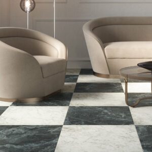 Dark green marble tile and white marble tile in a checkerboard pattern with modern beige sitting chair and sofa