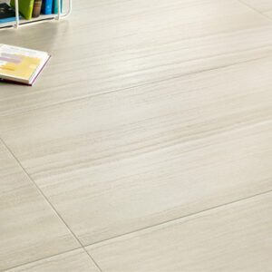 Beige striated floor tile laid out with books