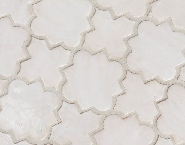 Fancy white glossy arabesqued shaped zellige tiles