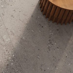dark gray fossilized floor tile with brown accent table
