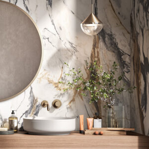 White, black, and brown marble look large format tiled bathroom wall with round mirror and round vessel sink