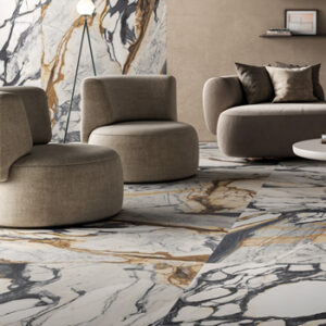 White, black, and brown marble look large format tiled living space with beige sitting chairs and sofa
