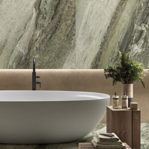 Large format green marble look tiled bathroom wall