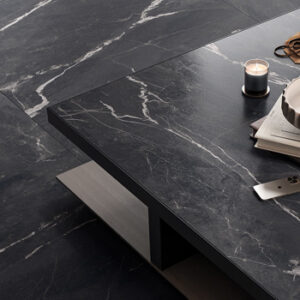 Large format black and white marble look tiled floor and table top