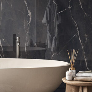 Large format black and white marble look tiled bathroom wall