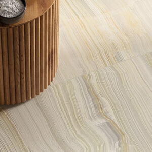 Large format pale green marble look tiled floor with wooden accent table