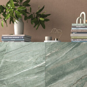 Large format pale green marble look tiled wall shelf with plant and books