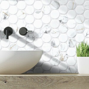 White marble look pennyround tiled bathroom wall with white vessel sink and black wall-mount faucet