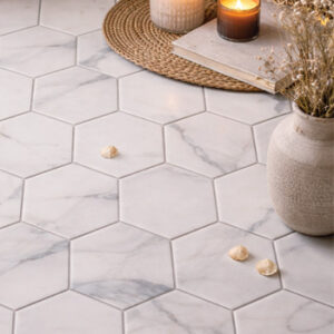 White marble look hexagon tiled floor with clay vase and dried flowers