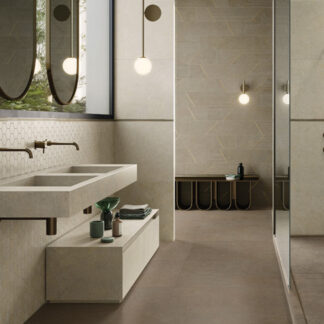 Beige stone-look tiled bathroom and shower featuring hexagon mosaics on wall