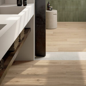 beige wood look tiled bathroom floor with white floating double sink
