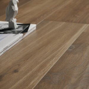 brown wood look tiled floor with falcon figurine
