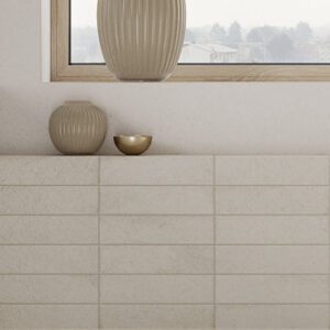 white brick tiles on a bathroom wall with vases
