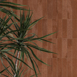terracotta brick tiles vertically stacked on a wall with large plant
