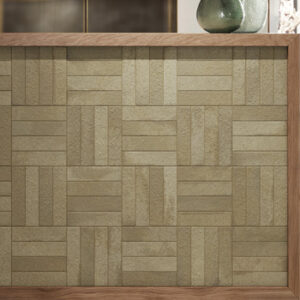 green brick tiles in a hatch pattern on a half wall wall
