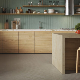 Pale green long, narrow tiled modern kitchen backsplash with gray long, narrow tiles in a herringbone pattern on the floor