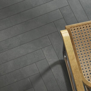 black narrow tiled floor in a herringbone pattern