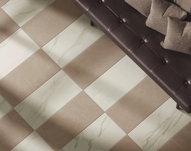 White and beige marble look porcelain tiles in a checkerboard pattern on a floor with leather upholstered bench with pillows