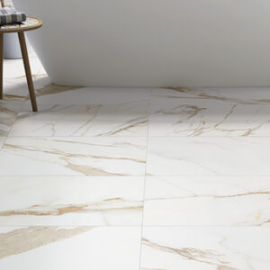 Calacatta gold look porcelain tiled bathroom floor with soaking tub and stool