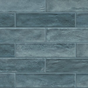 blue 3x12 glossy tiles in a brickjoint pattern