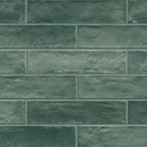 Green 3x12 glossy tiles in a brickjoint pattern