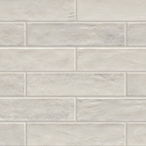 Gray 3x12 glossy tiles in a brickjoint pattern