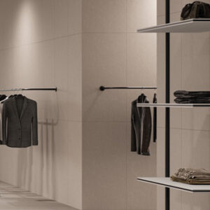 Beige large format tiled walls in a mens clothing store