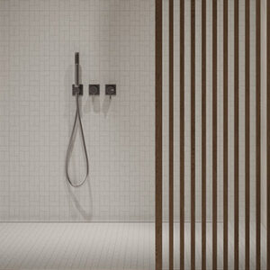 pale gray basketweave mosaic tiles in a shower