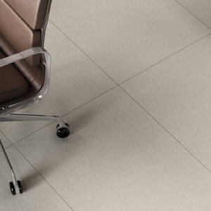 pale gray fabric look porcelain tiled floor with brown office chair