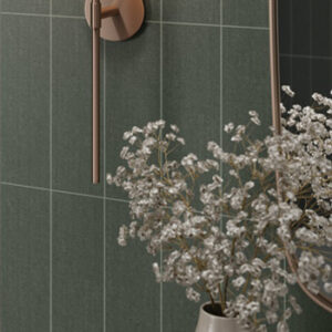 green fabric look porcelain subway tiled wall with dried flower arrangement