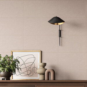 beige fabric look tiled wall with light scone and accent table with home decor