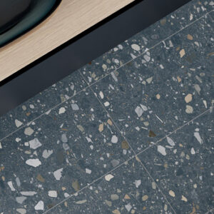 blue terrazzo look porcelain tiled bathroom floor with sink vanity top-down view