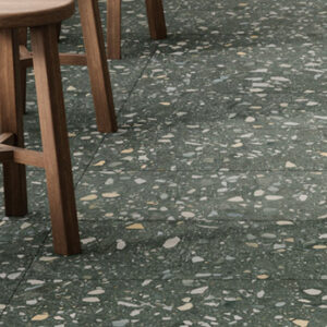 green terrazzo look porcelain tiled floor with wood stools