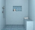 Clean lines meet coastal calm in this serene shower stall. The Cabana Collection pairs 2"x10" subway tile with hex and penny mosaics in sea-inspired tones—simple, timeless, and effortlessly fresh.🐳 🌊